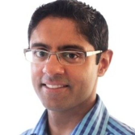 Parth_Chanda, Founder and CEO of Lextegrity seen posing for a photo in white and blue color strip pattern shirt